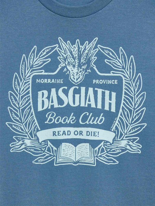 A close-up of a heathered blue t-shirt featuring a white graphic print of a dragon, laurel wreath, and an open book with the text 'BASGIATH Book Club' and 'READ OR DIE!'.