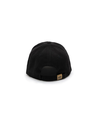 Black cap with a brand tag on a white background