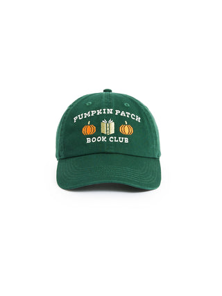A dark green baseball cap featuring embroidered text that reads 'PUMPKIN PATCH BOOK CLUB' with small pumpkin and book graphics, shown against a plain white background.