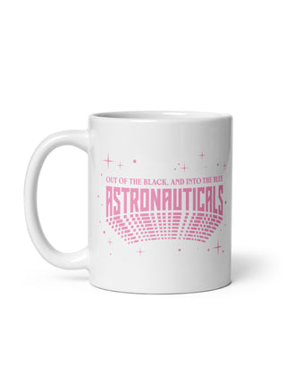 A white ceramic mug with a pink graphic design that reads 'OUT OF THE BLACK, AND INTO THE BLUE ASTRONAUTICALS' with a retro radar pattern and stars.