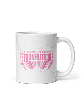 A white ceramic mug with a pink graphic design that reads 'OUT OF THE BLACK, AND INTO THE BLUE ASTRONAUTICALS' with a stylized rocket and stars, shown on a plain white background.