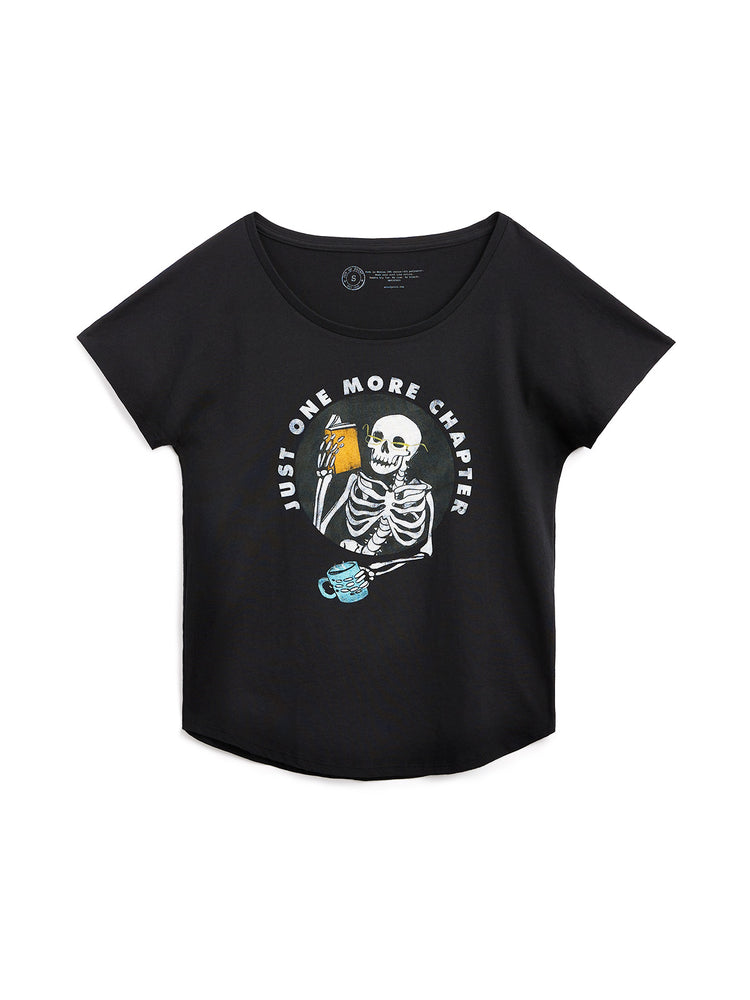 Black t-shirt with skeleton graphic and 'Just One More Chapter' text on a white background