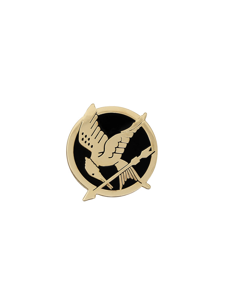 An enamel pin with a gold finish featuring the Mockingjay symbol from the Hunger Games series.
