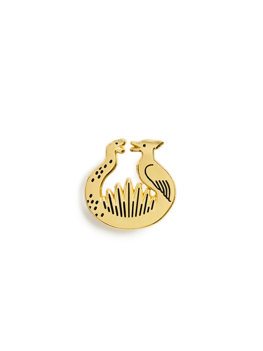 A gold Sunrise on the Reaping logo hard enamel pin centered on a plain white background.