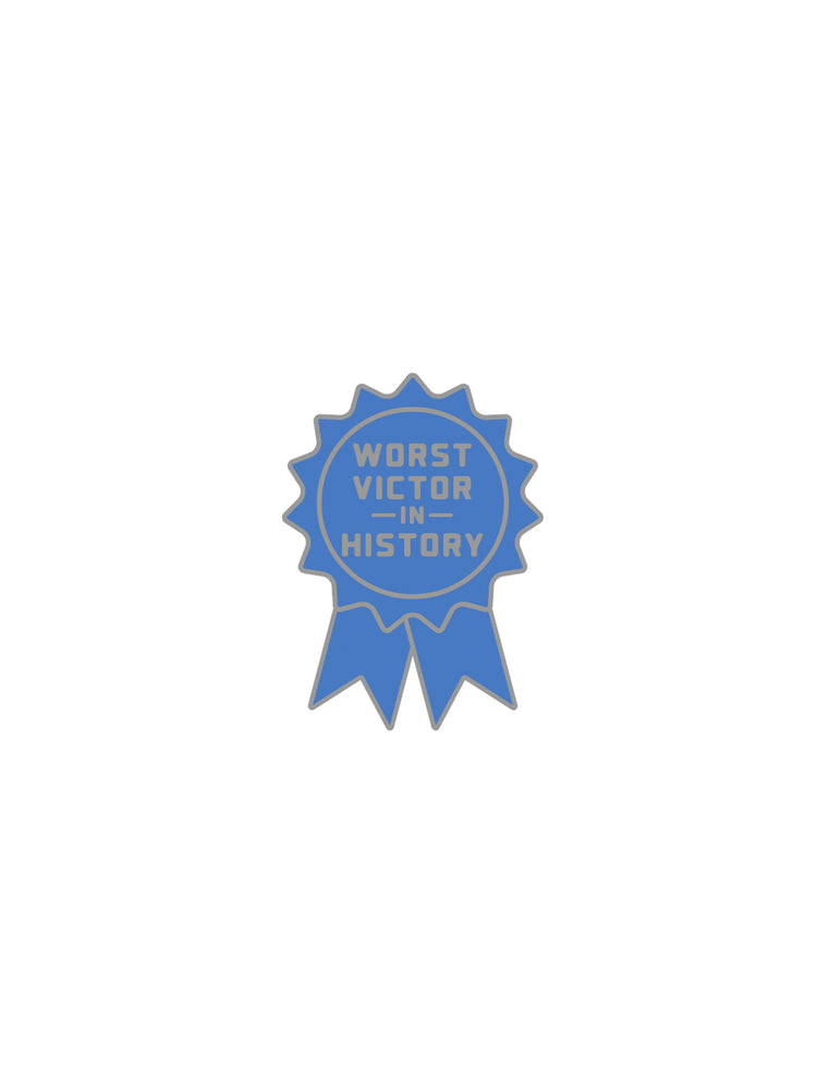 Blue badge pin with 'Worst Victor in History' text on a white background