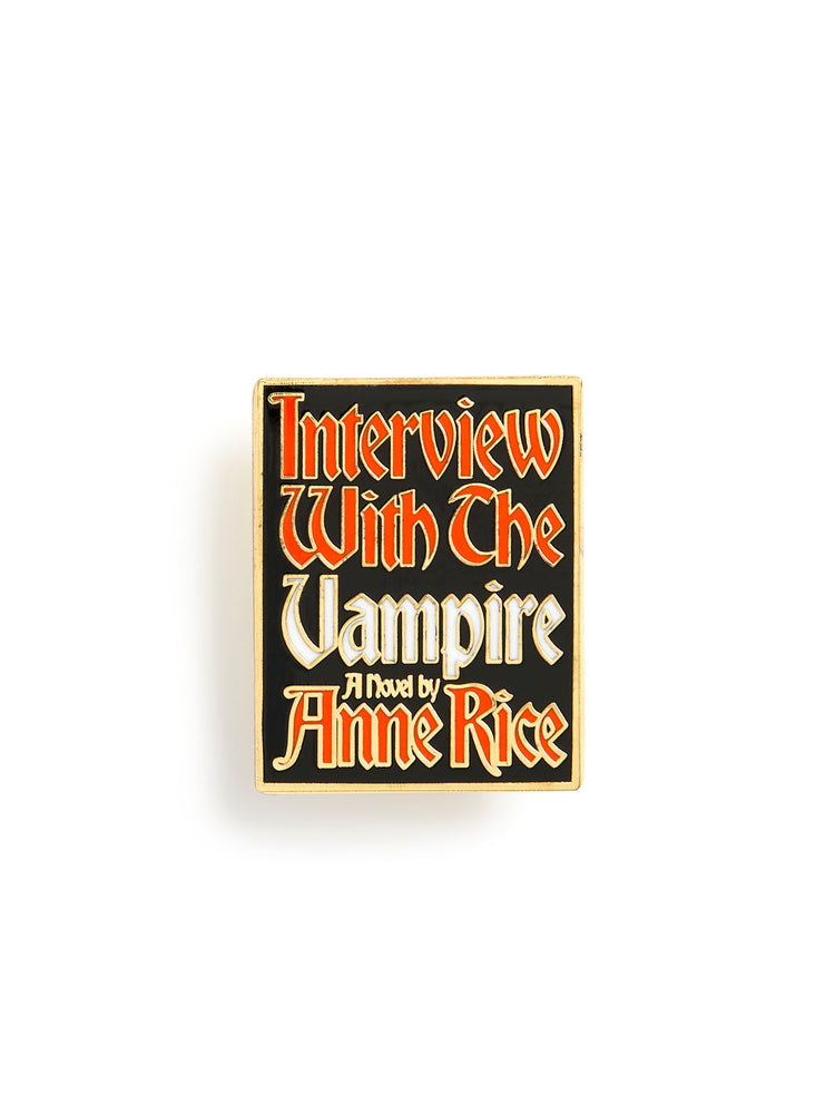 A rectangular book cover or poster-style product on a plain white background, featuring the title 'Interview With The Vampire' and 'A Novel by Anne Rice' in stylized red and white lettering on a black field with a thin gold border.