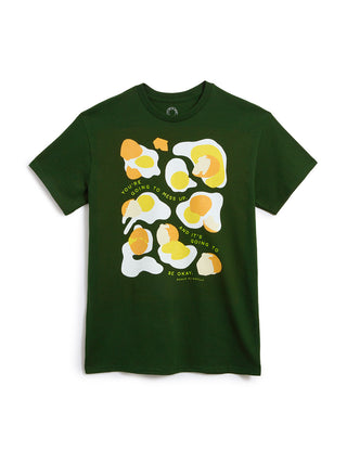 Green t-shirt with a graphic design of eggs and text on a white background