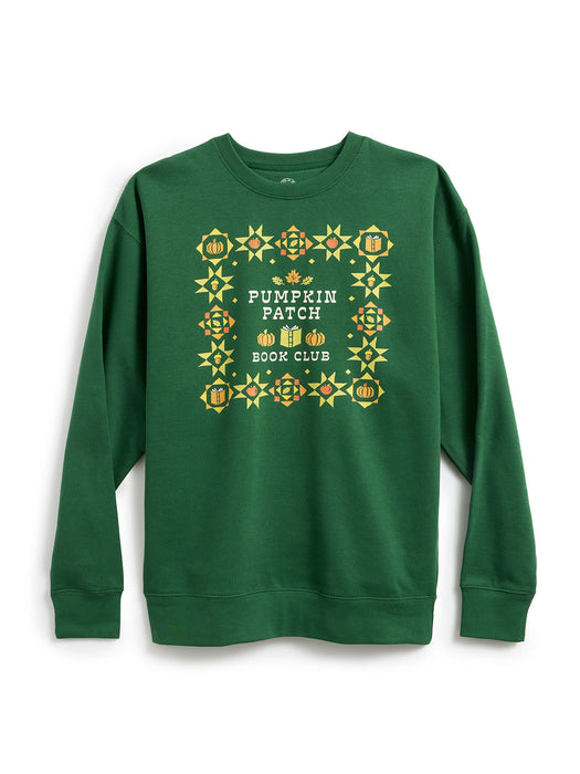 A green crewneck sweatshirt featuring a 'Pumpkin Patch Book Club' graphic on the chest, surrounded by a decorative border of pumpkins and geometric patterns in yellow, orange, and white.