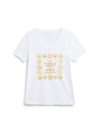 A white short-sleeve V-neck t-shirt with a colorful graphic on the front featuring autumn-themed illustrations and the text 'Pumpkin Patch Book Club'.