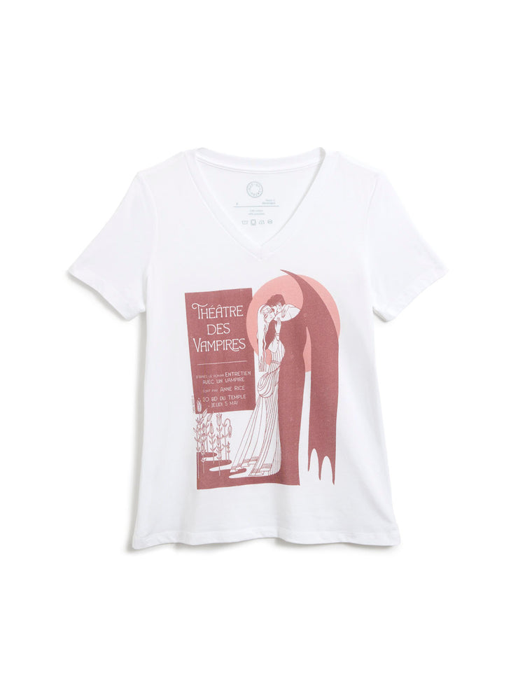 A white short-sleeve v-neck t-shirt featuring a vintage-style art print of a vampire in a long black cape with a large pink-red circular backdrop behind it, kissing a woman in a white gown, with a poster reading 'THEATRE DES VAMPIRES'.