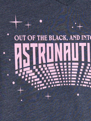 Close-up of a heather navy blue graphic print on a t-shirt. The design features the text 'OUT OF THE BLACK, AND INTO ASTRONAUTY' in light pink.