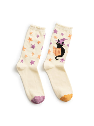 Pair of socks with star and cat designs on a white background