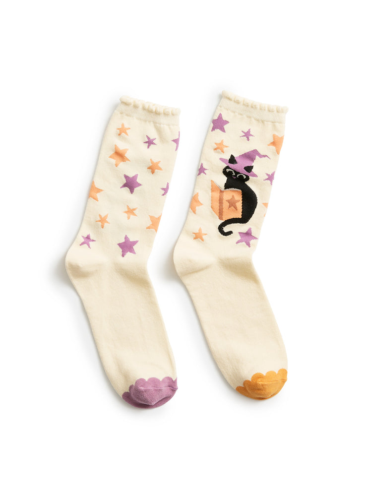 Pair of socks with star and cat designs on a white background