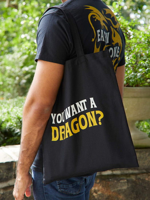 Person wearing a black tote bag with 'YOU WANT A DRAGON?' text and a dragon design.