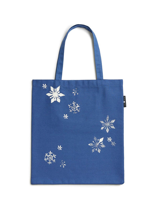 Blue tote bag with white snowflake patterns on a white background