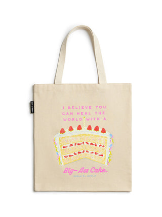 Tote bag with cake illustration and text on a white background