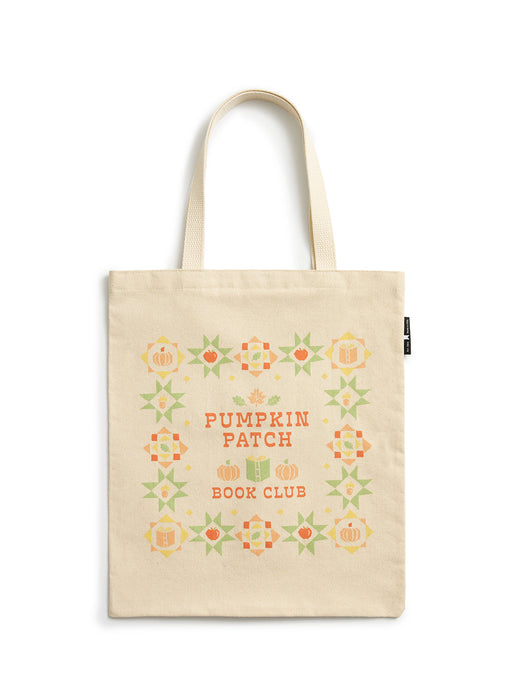 A natural canvas tote bag with a warm cream tone, featuring a decorative autumn-themed graphic that reads 'PUMPKIN PATCH BOOK CLUB' in orange, surrounded by orange pumpkins and green stars.