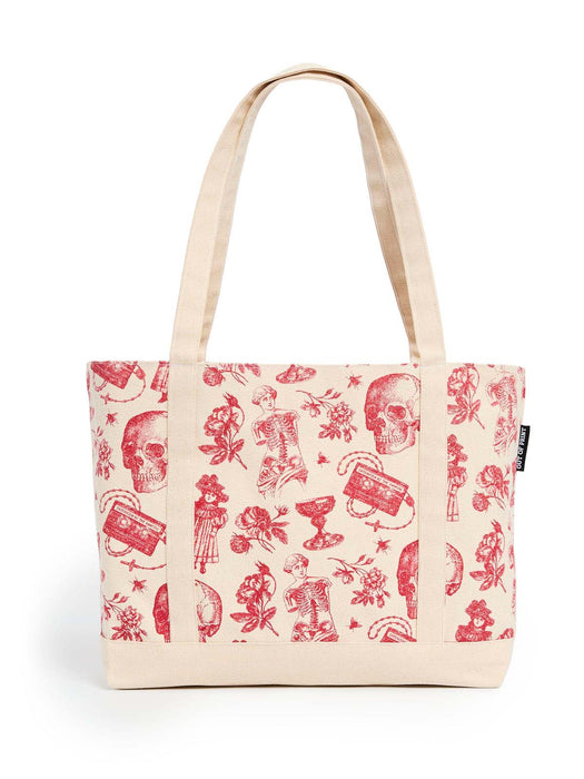 A canvas tote bag with a cream background and a red vintage-style print featuring skulls, roses, skeletons, and goblet, shown against a plain white background.