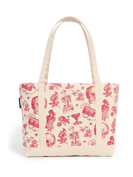 An off-white canvas tote bag featuring a red gothic-style print of skulls, roses, and skeletons, with dual top handles, shown against a plain white background.