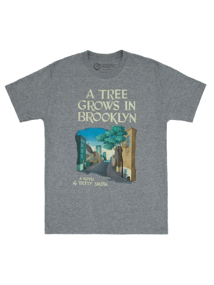 Heather gray fitted unisex t-shirt with a printed design featuring an illustration and the title 'A Tree Grows in Brooklyn' along with the name 'Betty Smith'.
