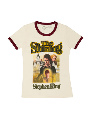 women's ringer t-shirt with 'The Shining' movie cover art, predominantly cream color with maroon trim, featuring the film's characters and Stephen King branding.