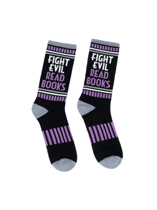 A pair of black athletic socks with the text 'FIGHT EVIL, READ BOOKS' written in white. The socks have purple stripes on the side.