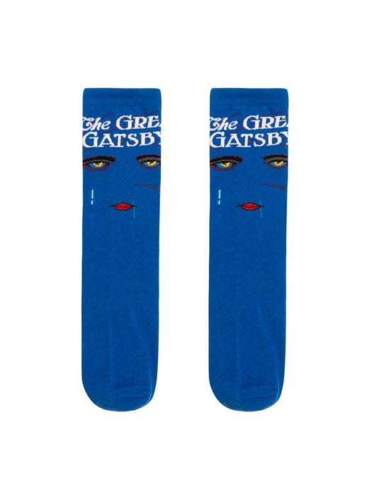 A pair of blue socks with text and a face illustration related to the novel 'The Great Gatsby'.