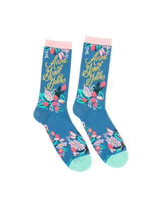 A pair of colorful Anne of Green Gables themed socks with floral patterns and text design.